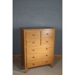 Light oak chest of drawers, the rectangular top above five long draws, 120cm tall 90cm wide