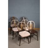 Set of six elm seated stick and wheelback kitchen chairs, comprising two carvers and four