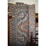 Middle Eastern style rug, the brown ground with blue floral design and multiple borders, 191cm x