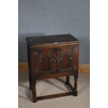 17th Century style cupboard, the rectangular top above two panelled doors, raised on turned legs