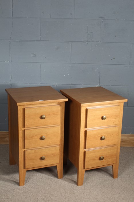 Pair of oak bedside cupboards, three draws to the base, 75.5cm tall