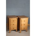 Pair of oak bedside cupboards, three draws to the base, 75.5cm tall
