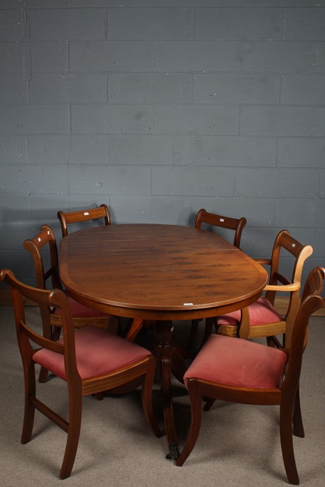 Mahogany effect twin pillar dining table, together with a set of six chairs (7)