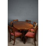 Mahogany effect twin pillar dining table, together with a set of six chairs (7)