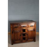 Oak Arts and Crafts style sideboard, the rectangular top above three drawers and storage space for