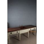 Victorian style table and sink, having brass taps on a mahogany top, raised on a white painted