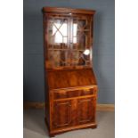 Mahogany effect bureau bookcase with two glazed doors above the fall, one draw and cupboard to the