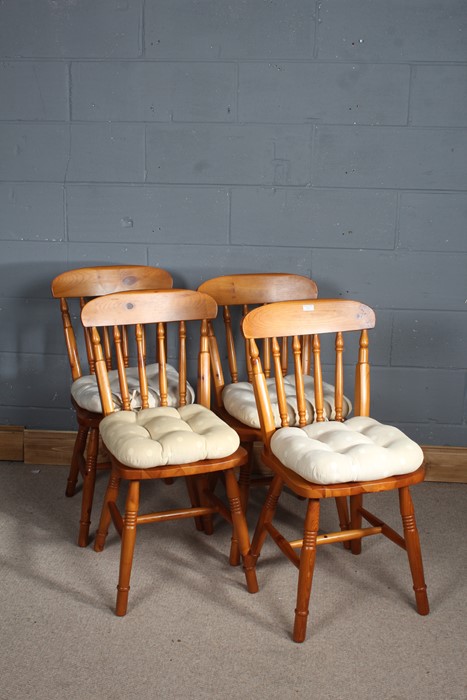 set of Four spindle chairs, with dished seats above turned legs