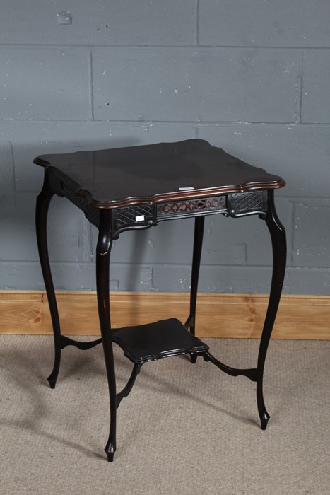 Edwardian mahogany centre table, the square top above a fret carved frieze and under tier, raised on