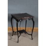 Edwardian mahogany centre table, the square top above a fret carved frieze and under tier, raised on