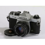 Asahi Pentax K1000 camera, with a Pentax-M f/2 50mm lens