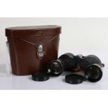 Pair of Swift Audubon 8.5 x 44 binoculars, housed in a brown leather case