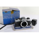 Olympus OM10 camera body, together with an OM10 manual adapter, both in original packaging (2)