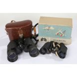 Pair of Carl Zeiss Jena Jenoptem 8x30 binoculars, housed in a brown leather travelling case and