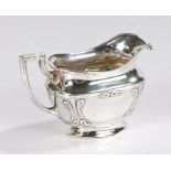 George V silver milk jug, London 1924, makers mark rubbed, with angular handle and Art Nouveau style