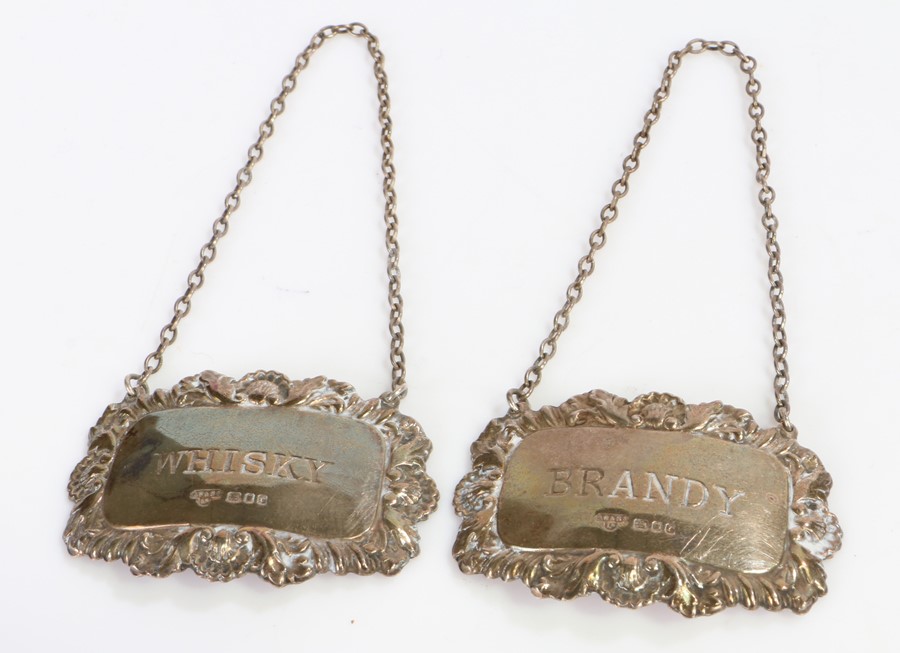 Two Elizabeth II silver decanter labels, London 1972, maker A Chick & Sons Ltd. with acanthus leaf