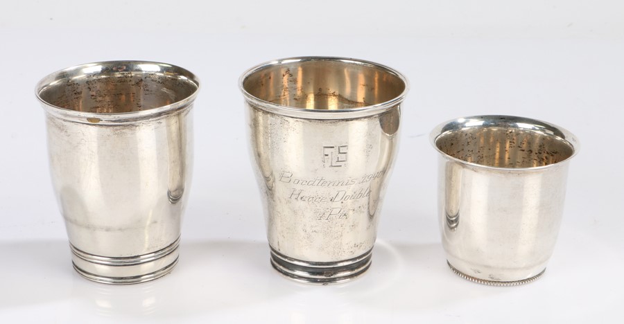 Three 20th Century Danish silver beakers, two awarded as tennis prizes, dated 1940 and 1943, the