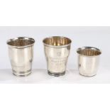 Three 20th Century Danish silver beakers, two awarded as tennis prizes, dated 1940 and 1943, the
