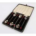 Set of six silver plated Art Deco coffee spoons, with shell pattern bowls and red coffee bean form