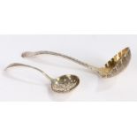 George III silver ladle with later embossed berry decoration to the bowl, George V silver sifter