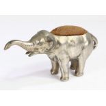 Novelty base metal pin cushion modelled as an elephant with trunk raised, 18cm wide, 9cm high