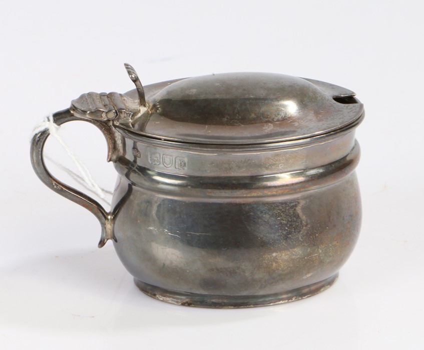 Victorian silver mustard pot, London 1897, maker Henry Stratford, the domed cover with scroll