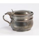 Victorian silver mustard pot, London 1897, maker Henry Stratford, the domed cover with scroll