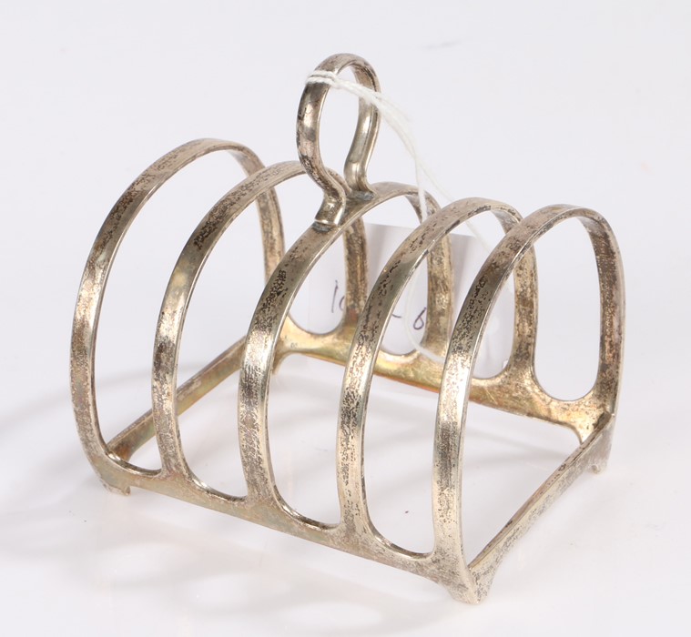 George VI silver four slice toast rack, Birmingham 1937, maker Adie Brothers Ltd. with loop finial