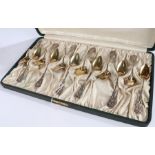 Set of twelve American sterling silver teaspoons, the Art Nouveau foliate cast handles monogrammed