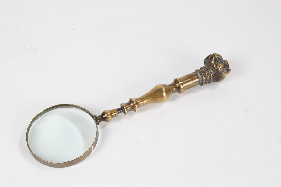 Late 19th Century brass magnifying glass with bull mastiff head finial, brass strapping to the