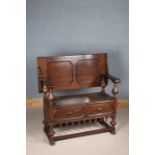 Jacobean style oak monks bench, having sliding and lifting top above a lidded storage compartment,