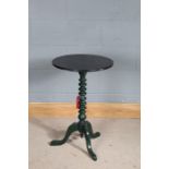 Painted side table, the circular black painted top raised on a green painted bobbin turned stem