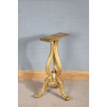 19th century carved and gilt table pedestal, with triple beaded scrolled supports raised on three