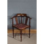 Edwardian mahogany inlaid corner chair, centred with an inlaid motif of musical instruments, pierced
