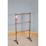 19th Century mahogany towel stand, with turned finials and horizontal slats, on flattened curved