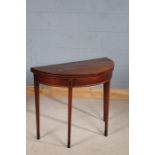 George III mahogany and boxwood demi-lune card table, the hinged top have crossbanded boxwood