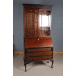 Early 20th century mahogany bureau bookcase, the moulded top above a pair of astragal glazed doors