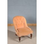Victorian button back nursing chair, having baluster front legs and sabre back legs, the brass and