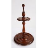 19th Century mahogany pipe stand, the turned central stem with recesses for eight pipes, above a