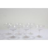 Set of six glass champagne bowls, with etched star decoration and star cut bases, 11.5cm high