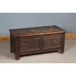 18th century style carved oak coffer, the hinged lid with carved foliate swags and similar front