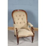 Victorian mahogany button back armchair, having open scroll armrests and turned knopped legs,