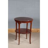 Edwardian mahogany two tier table, the circular top with satinwood crossbanding above a second