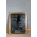 Pair of Regency style rectangular wall mirrors with gilding and black interlaced pattern to frame,