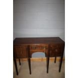 Victorian style mahogany sideboard, with central drawer flanked by a deep drawer and cupboard,