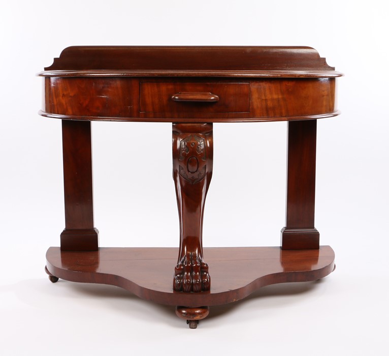 Early 20th Century mahogany demi-lune occasional table, with frieze drawer above a scroll carved