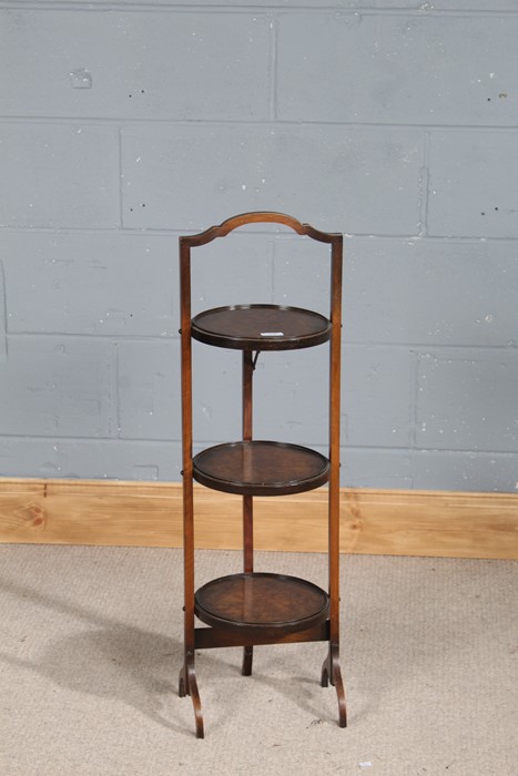 20th century walnut folding cake stand, with three circular platforms, 90cm high