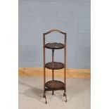 20th century walnut folding cake stand, with three circular platforms, 90cm high