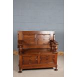 Jacobean style oak monks bench, the adjustable top and front with geometric moulding, with lidded