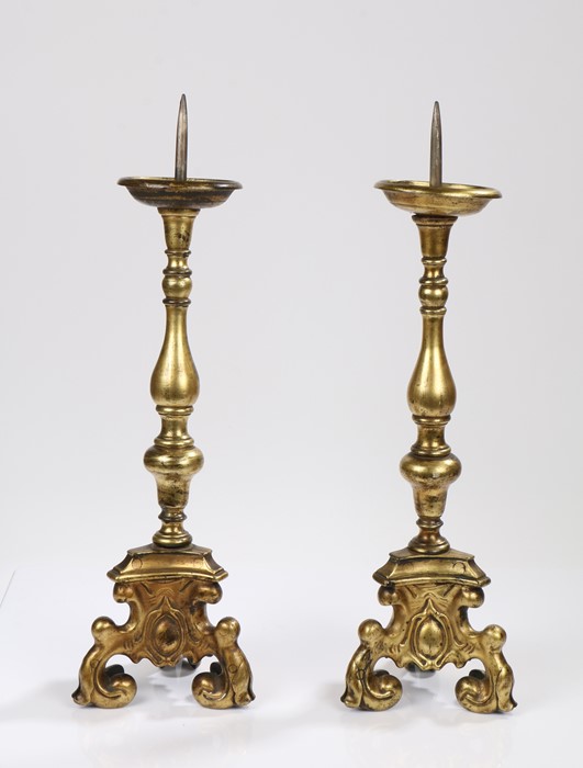 Pair 18th Century gilt bronze pricket altar sticks, with knobbed stems and trefoil scroll legs, 60cm